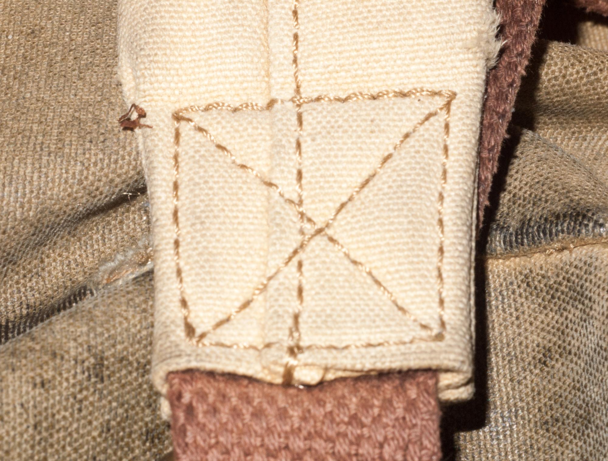 close-up of embroidered sampler with textured threads